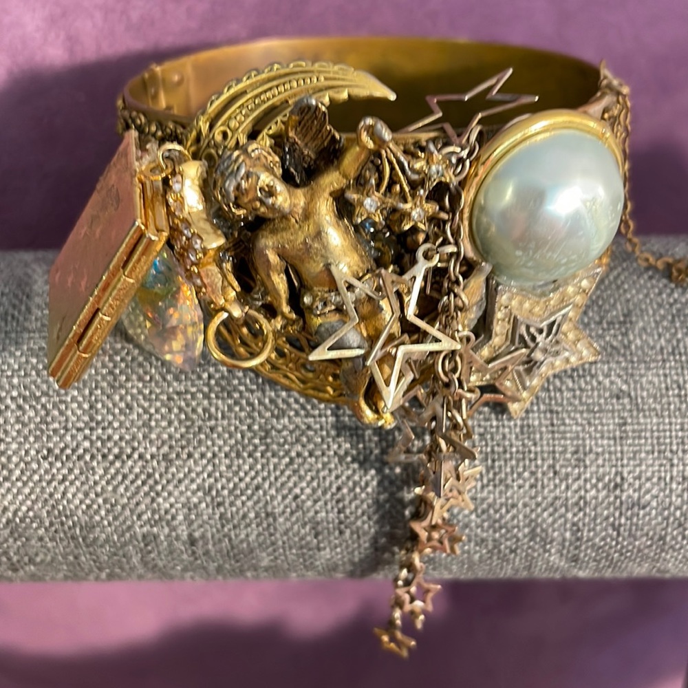 Antique gold bracelet with one of a kind embellishment angel star theme